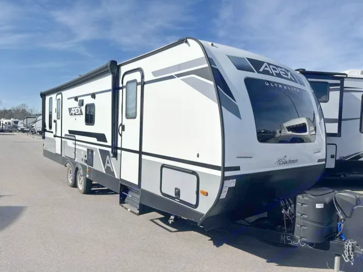 Modern white and grey Apex Ultralite travel trailer. Perfect for an RV rental, ready for your outdoor adventure.. Coachmen Apex 2022