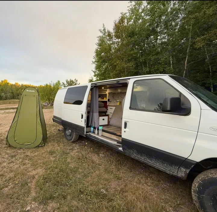 This rv rental camper van, with its pop-up privacy tent, is ready for off-grid adventures in nature.. Ford Ford E350 2005