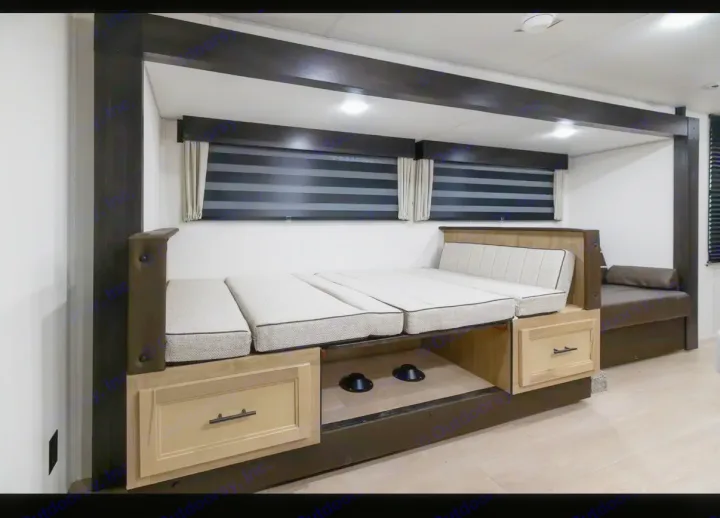 RV rental interior: modern bunk beds with storage, striped blinds, and recessed lighting for comfortable travels.. Forest River Cherokee Grey Wolf 2026