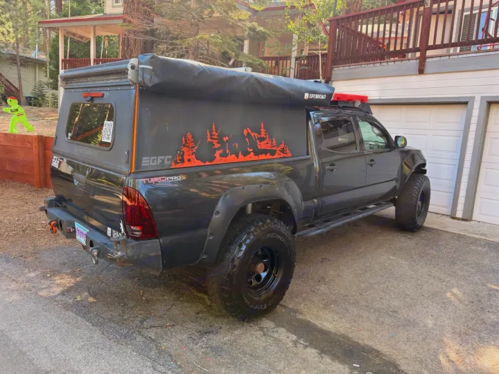 Dark gray off-road Tacoma truck with GFC pop-top camper. Perfect for an RV rental, ready for adventure & overlanding.. Toyota Tacoma - GoFastCamper 2007