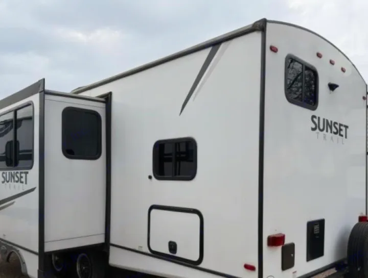 This white Sunset Trail RV rental, a travel trailer with an extended slide-out, is ready for your next adventure.. Crossroads RV Sunset Trail Super Lite 2022