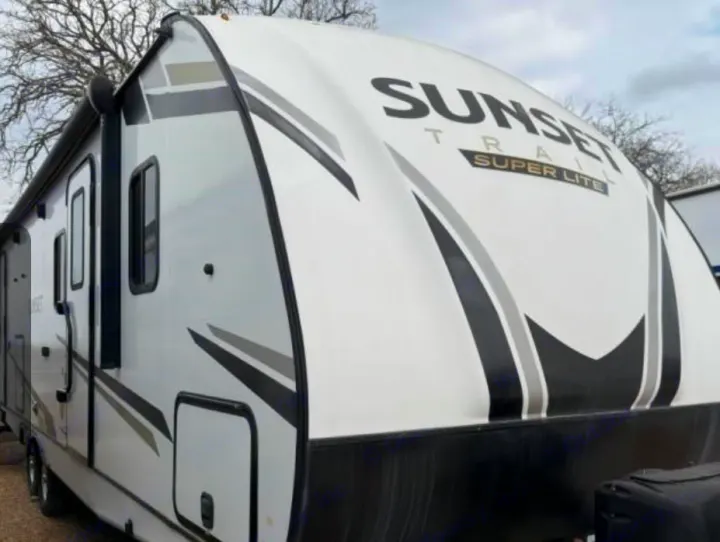 This white Sunset Trail Super Lite travel trailer is ready for your next rv rental adventure. Perfect for camping.. Crossroads RV Sunset Trail Super Lite 2022