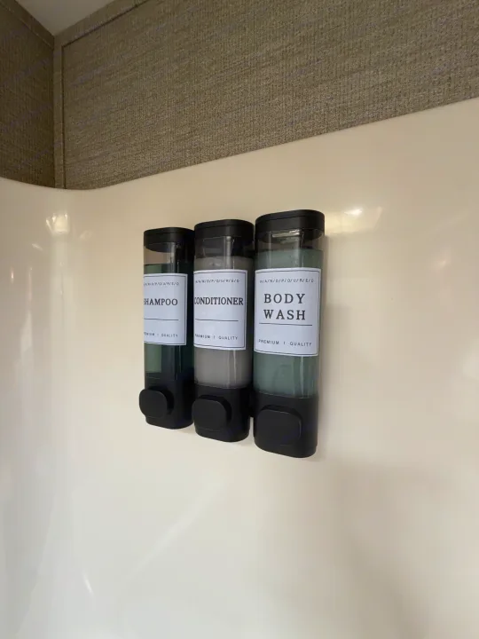 RV rental shower amenities: wall-mounted dispensers for shampoo, conditioner, and body wash, ensuring convenient access.. Denali Denali Fifth Wheel 2017
