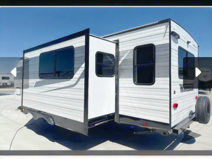 This white RV rental travel trailer, with a side slide-out extended, is ready for your next adventure.. Winnebago Access 2025