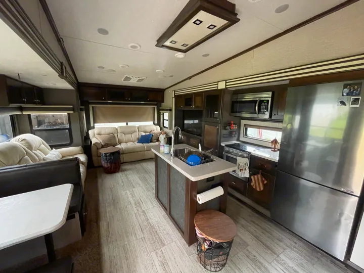 Step inside this inviting rv rental! Featuring a spacious living room with a sofa, and a well-appointed kitchen with an island.. Vanleigh RV Pinecrest 2020
