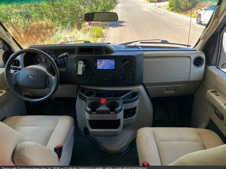 RV rental: Ford E-Series van interior, showing the dashboard, steering wheel, front seats, and the road ahead.. Forest River Forester Classic 2291S 2020