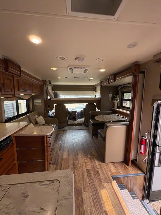 Explore this comfy RV rental motorhome. Features a full kitchen, dinette, sofa, and overhead bed in a spacious interior.. Jayco Precept 2017
