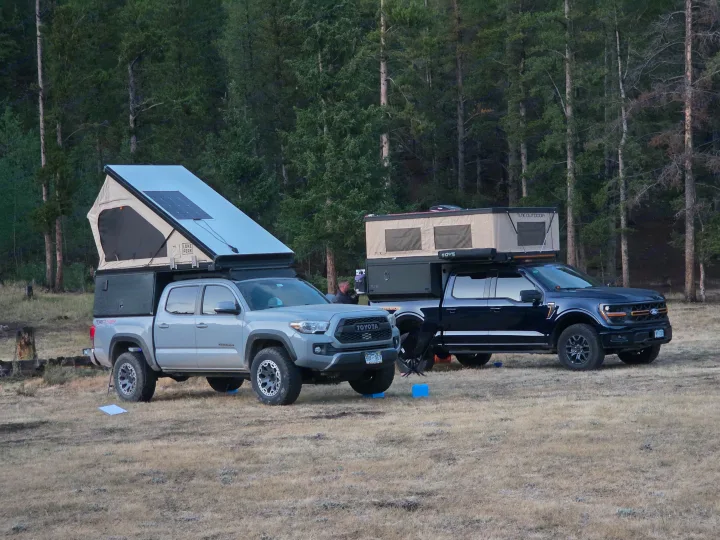 Overland truck campers: A Toyota Tacoma & Ford F-150 showcase rugged RV rental setups in nature. Perfect for outdoor adventure.. Toyota Tacoma 2018