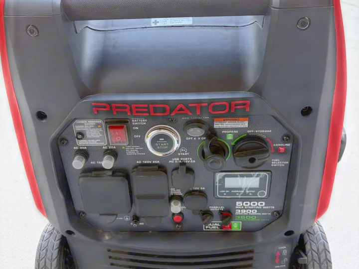 RV rental power: A Predator dual-fuel generator's control panel, displaying engine controls, outlets, and carbon monoxide safety.. Jayco Jay Flight SLX Rocky Mountain Edition 2021