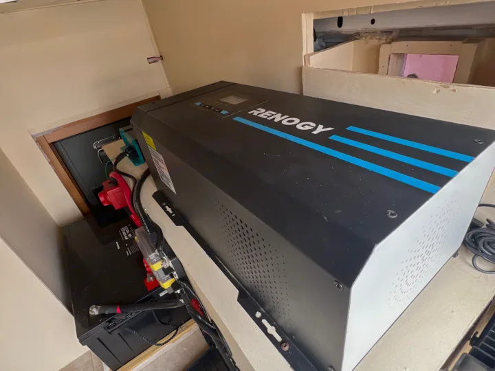Renogy inverter and battery power system installation visible in an RV rental interior, showing wiring and connections.. Dodge Ram Promaster 2500 2020