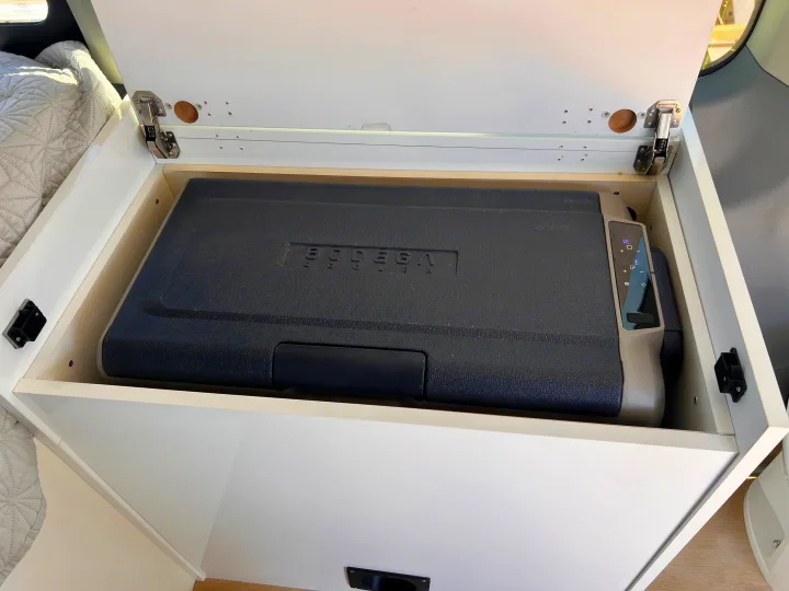 This RV rental features a Bodega portable fridge/freezer in a built-in storage compartment, perfect for travel.. Ford Transit 2016