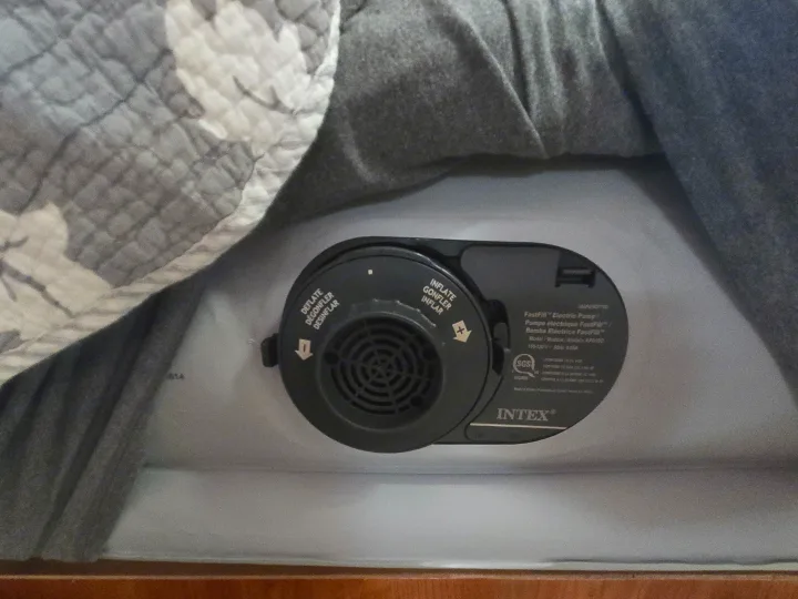 Built-in electric pump on an Intex air mattress, essential for a comfortable rv rental or camping trip. Inflate/deflate function visible.. Coachmen Freedom Express 2008