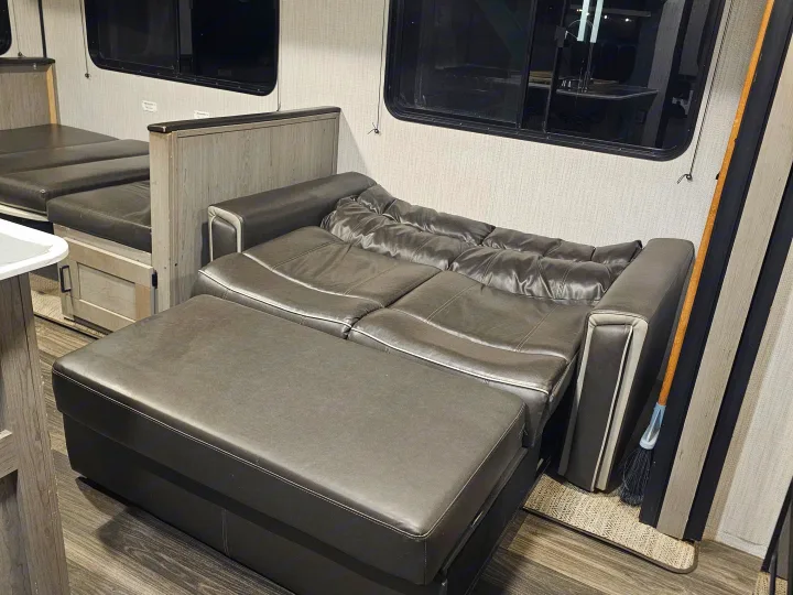 This RV rental features a versatile interior with a pull-out sofa and a convertible bed/dinette.. Heartland RVs Mallard 2021