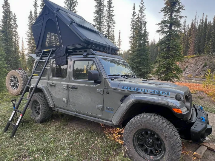Experience wilderness camping with this Jeep Rubicon and rooftop tent, an excellent rv rental for your next outdoor trip.. Jeep Rubicon 4XE 2022
