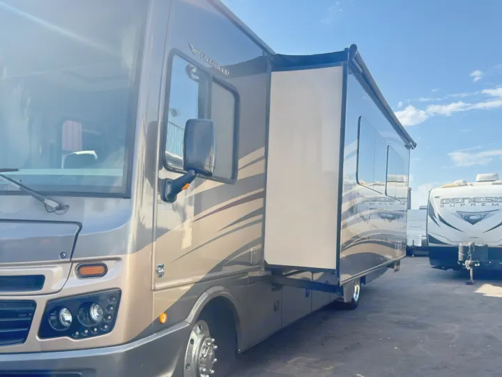 Spacious tan & brown Class A rv rental motorhome with slide-out extended for travel and adventure.. Fleetwood 35 K 2017