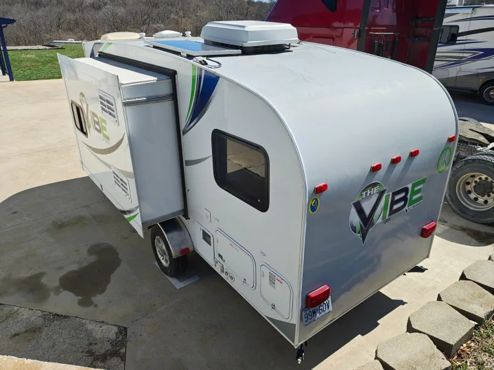 Explore the outdoors with this Vibe travel trailer RV rental, featuring solar panels for off-grid camping adventures.. Forest River V-Cross Vibe 2012