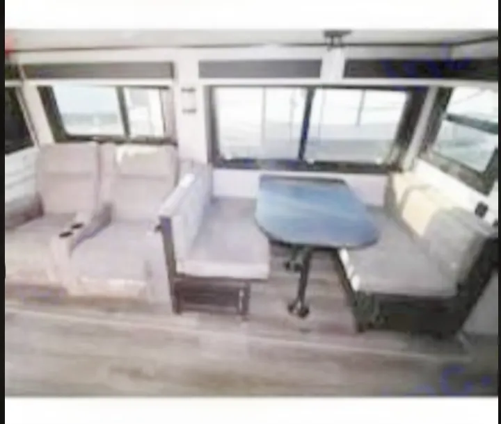 Explore this modern RV rental's living space: reclining sofas, a dinette, and large windows offer comfort and views.. Jayco White Hawk 2021