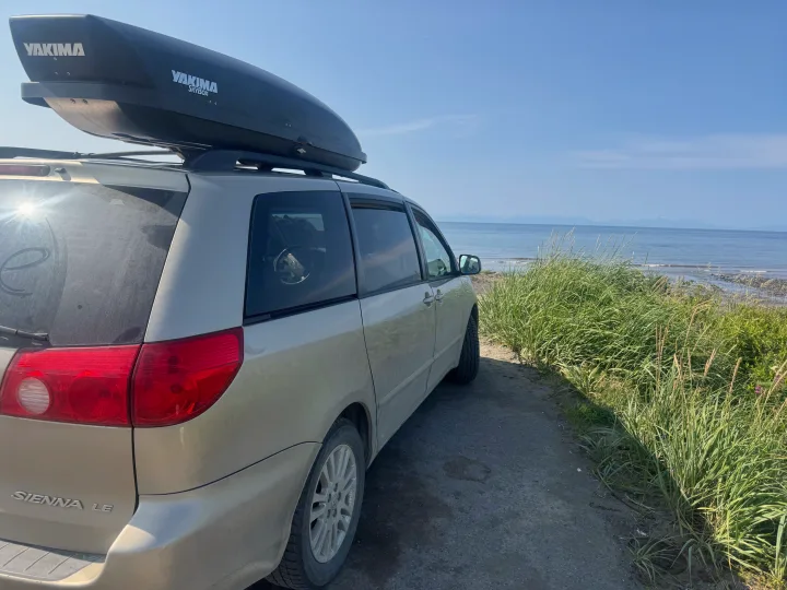 Road trip ready: Toyota Sienna minivan with Yakima cargo box by the ocean. Consider this for your next rv rental adventure!. Toyota Sienna 2009