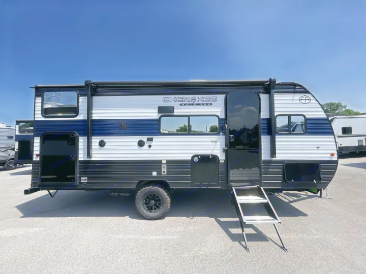 Explore the outdoors with this striking blue and white Cherokee Wolf Pup travel trailer, available for rv rental.. Forest River Cherokee Wolf Pup 2026