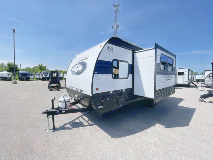 A new white and blue Cherokee Wolf Pup travel trailer, perfect for rv rental, parked on an outdoor lot on a sunny day.. Forest River Cherokee Wolf Pup 2026