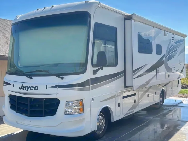 This bright white Jayco RV rental motorhome, with gray accents and an extended slide-out, is ready for adventure.. Jayco Alante 2018