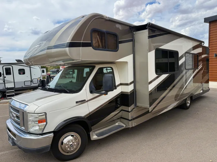 This Class C RV rental, a Ford E-450 motorhome, features brown & beige graphics, an open slide-out, and an awning.. Forester Forester Motorhome 2016