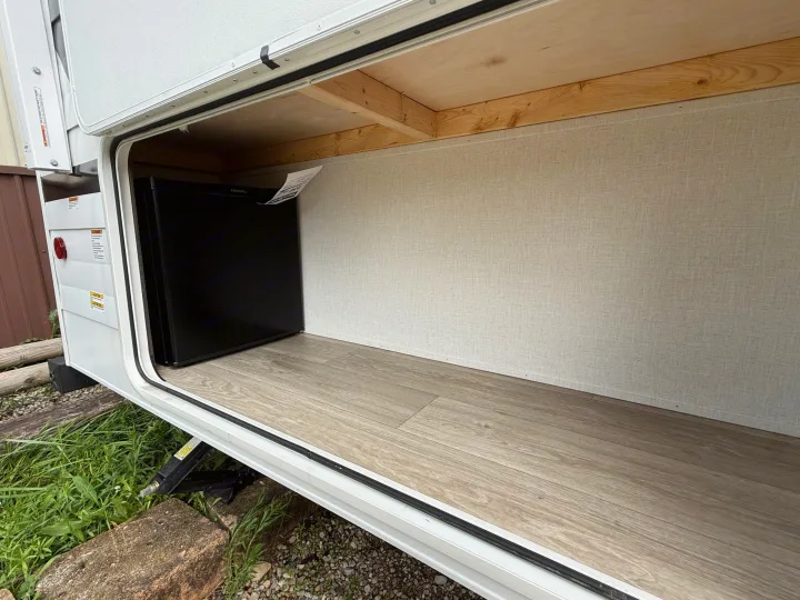 Explore the spacious exterior storage of this RV rental, featuring a built-in mini-fridge for your adventures.. Forest River Salem 2026