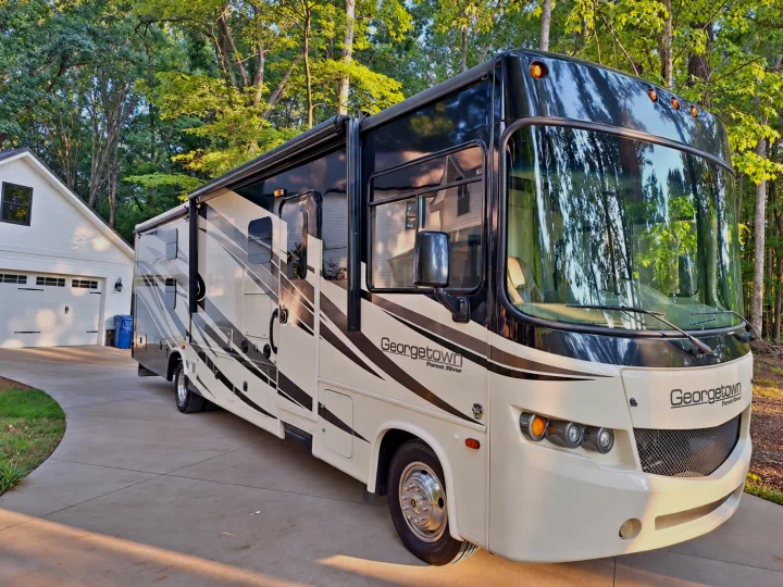 Georgetown RV rental parked on a driveway by a house. Perfect for your travel adventures.. Georgetown Georgetown Motorhome 2014