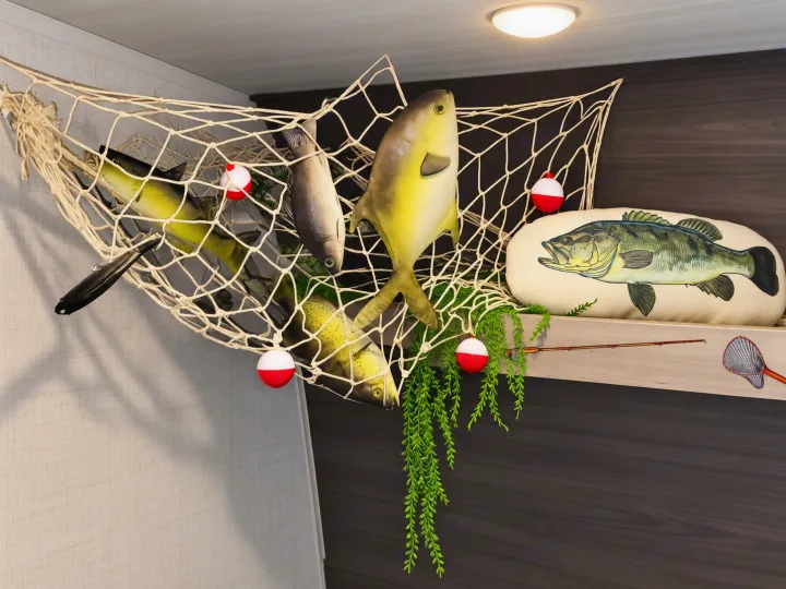 RV rental with charming fishing decor: net with toy fish, bobbers, bass pillow, rod, and foliage for an outdoorsy feel.. Keystone RV Hideout 2024