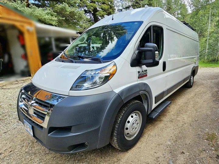 White Ram ProMaster camper van on a gravel road, ready for your next rv rental adventure.. Dodge Ram ProMaster 3500 2018