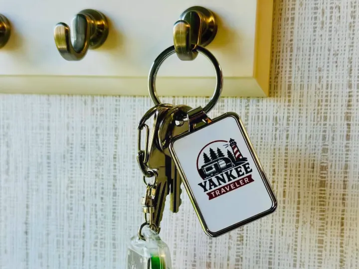 Keys for an RV rental from Yankee Traveler hang on a hook, ready for adventure.. Heartland RVs Trail Runner 2021