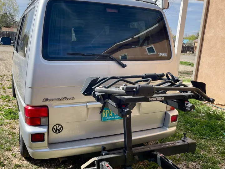 Silver Volkswagen EuroVan RV rental, equipped with a Yakima bike rack, ready for New Mexico adventures.. Eurovan Camper Eurovan Camper Class B 2002