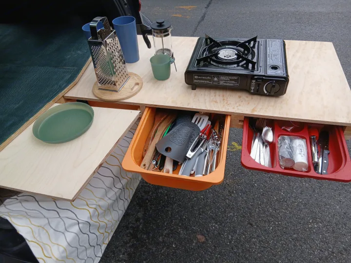 RV rental cooking station: portable gas stove, grater, French press, and drawers with utensils for easy camp meals.. Subaru Impreza 2018