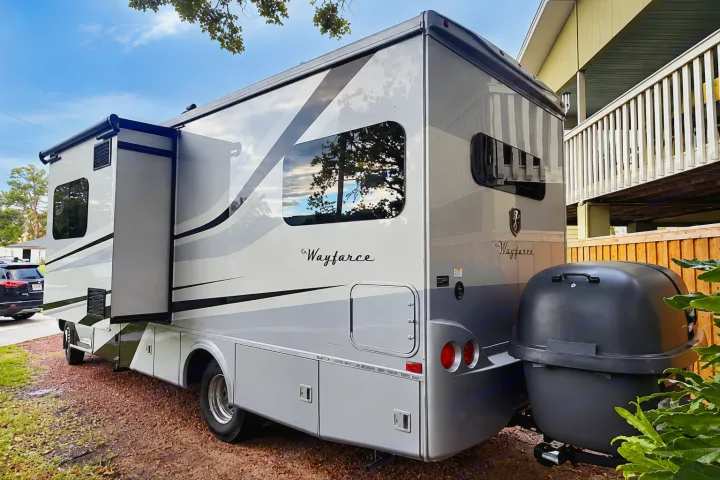 This modern grey and white Wayfarer RV rental, featuring an extended slide-out and rear cargo, is ready for adventure.. Tiffin Wayfarer 2020