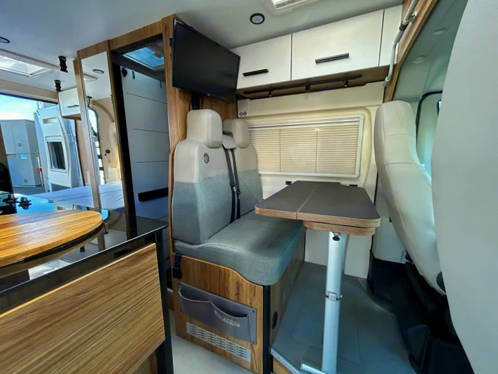 Modern rv rental interior with compact dinette, kitchen, and living space for comfortable road trips.. Font Vendôme Leader Camper Duo 2024