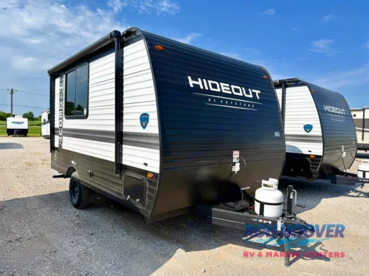 This black & white Hideout by Keystone RV rental travel trailer is ready for adventure.. Hideout Sport 140RE 2025