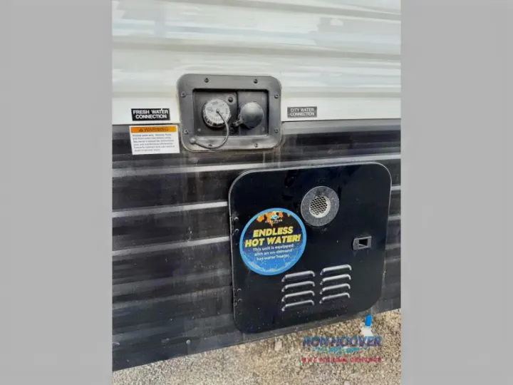This RV rental's utility panel highlights fresh water and city water connections, plus an on-demand hot water heater.. Hideout Sport 140RE 2025