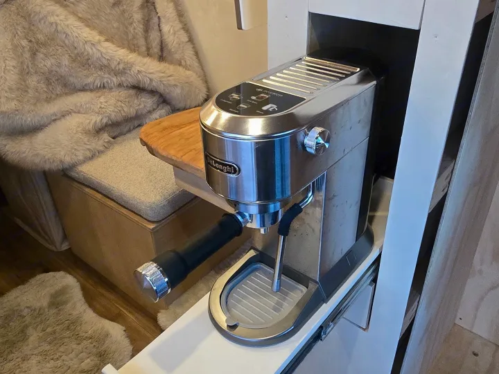 RV rental with a convenient De'Longhi espresso machine on a pull-out shelf. Enjoy gourmet coffee in this cozy, compact space.. Dodge 1500 2023