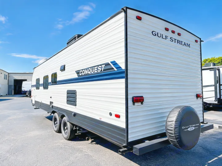 Explore the outdoors with this Gulf Stream Conquest travel trailer RV rental, ready for camping adventures.. Gulf Stream Conquest 2022