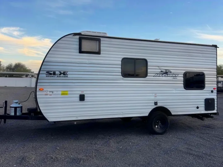 White Jayco Jay Flight SLX Sport Edition travel trailer, ready for your next RV rental adventure.. Jayco Jay Flight 2025