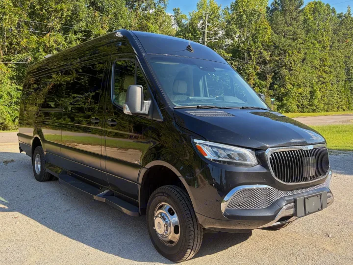 Black luxury Mercedes Sprinter van, ideal for RV rental. Features tinted windows, high-top, and custom grille.. Midwest Automotive Designs Luxe Cruiser 2025