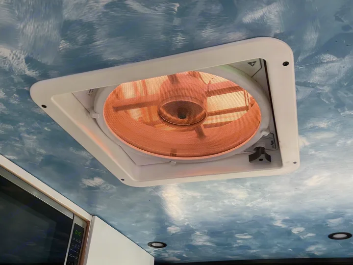 RV rental van interior: Illuminated ceiling vent fan, microwave, and a unique blue textured ceiling design.. Dodge Ram Promaster 2500 2014