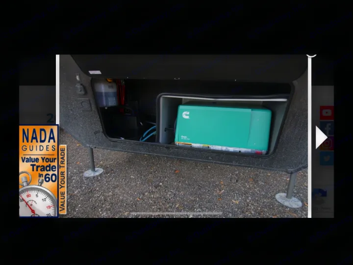 RV rental: Open front bay displays a green Cummins Onan generator, battery, and fluid tank for essential power.. Grand Design Momentum Toy Hauler 2020