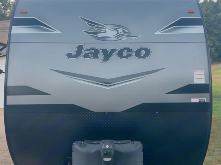 Front of a sleek gray Jayco travel trailer, ready for your next rv rental. Features brand logo & diamond plate accents.. Jayco Jay Flight 2023