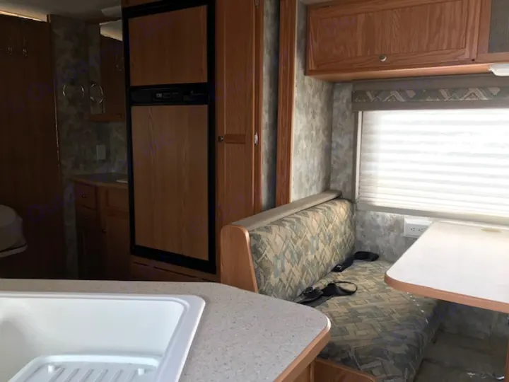 table converts to bed. Winnebago Access 2007