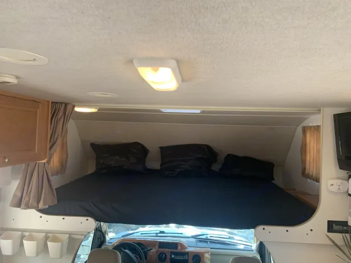 Top queen bed comfortably sleeps two. Winnebago Chalet 2010
