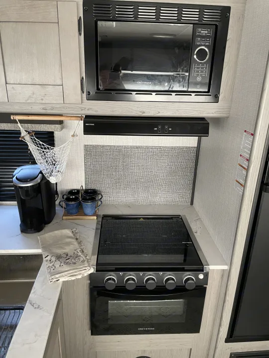 Gas stove and oven with a micro wave on top and all your silverware pots and pans included.. Other Other 2021