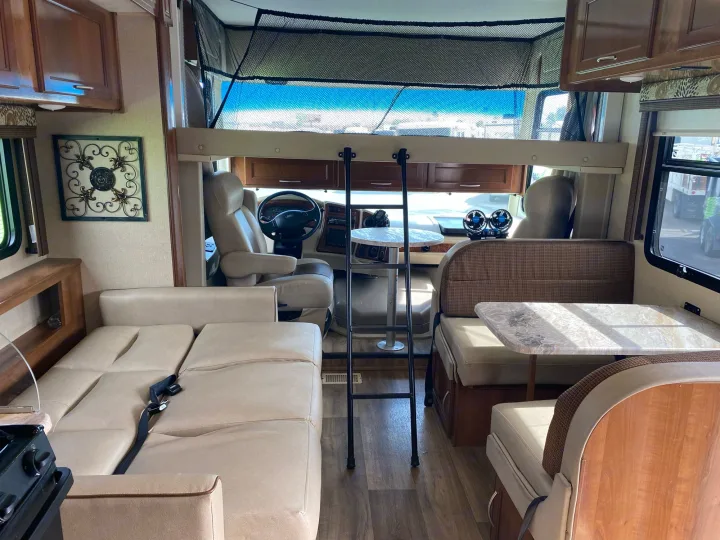 full drop down bed, full pull out sofa and dinette converts to bed. can sleep 5-6. Coachmen Pursuit, bunk beds, low mileage, saves gasoline 2019