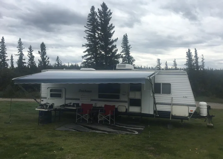 Perfect family set up , large awning keeps you dry. Dutchmen Lite 2005