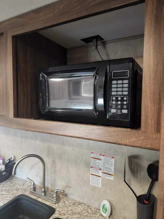 In this photo you will see the Microwave, Sink, and Stove, the spoons in the picture will be provided for your use as well.. Clipper Cadet 2017